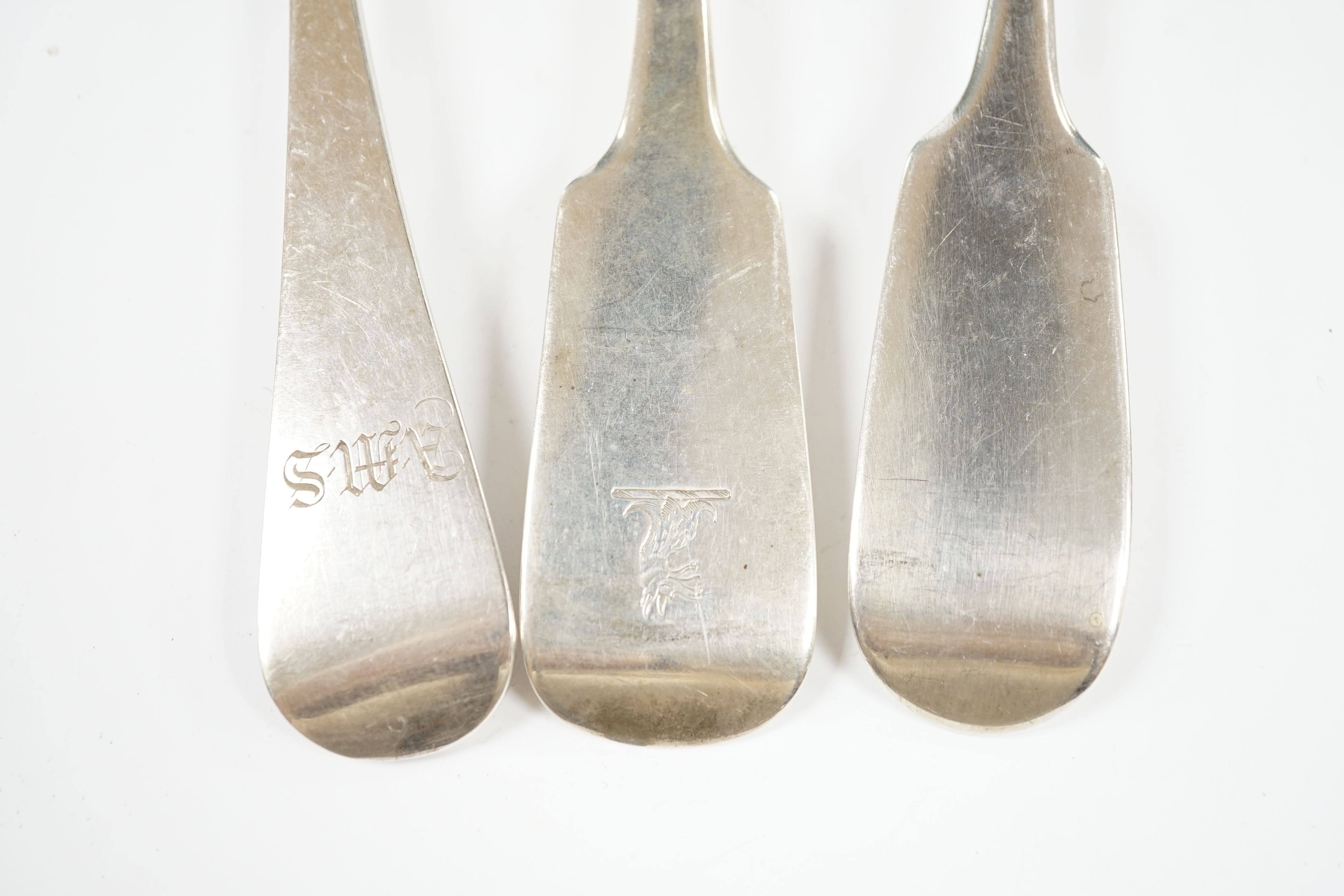 Three assorted 19th century silver basting spoons, including two fiddle pattern, earliest London, 1832, 31cm et infra, 13.8oz. Condition - fair